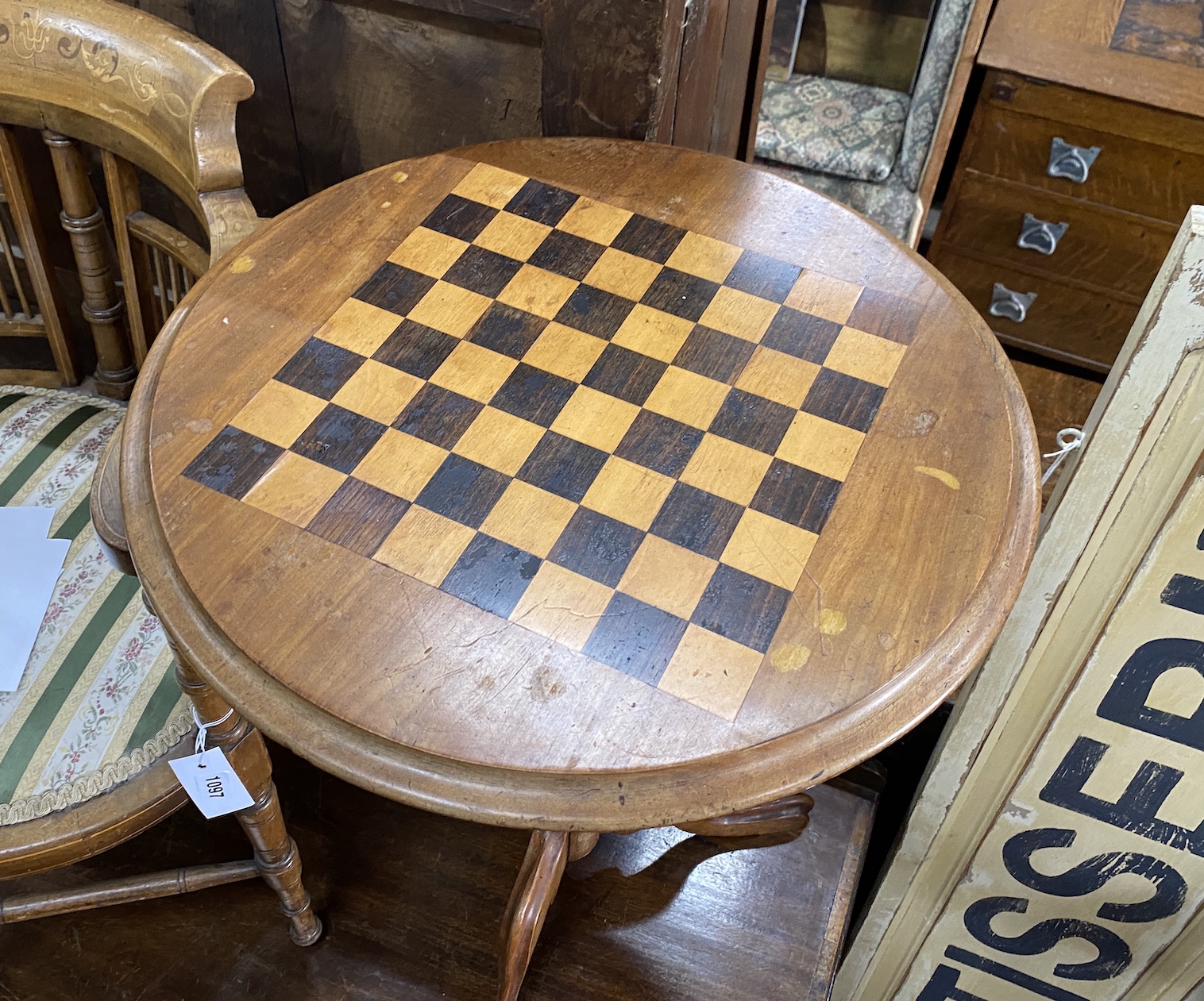 A Victorian inlaid walnut circular tripod games table, diameter 49cm, height 69cm together with a box wood chess set